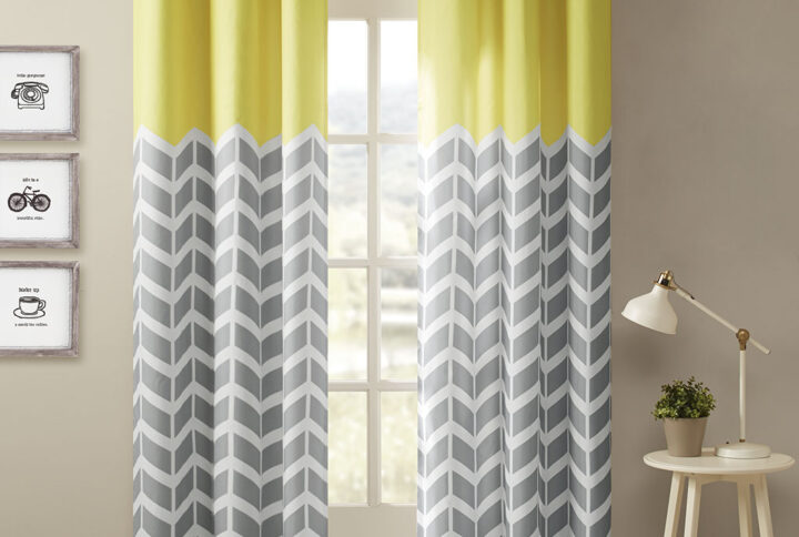 Alex Chevron Printed Room Darkening Grommet Top Panel Pair in Yellow From Intelligent Design