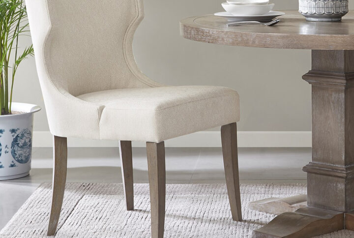 Carson Upholstered Wingback Dining Chair in Cream From Madison Park