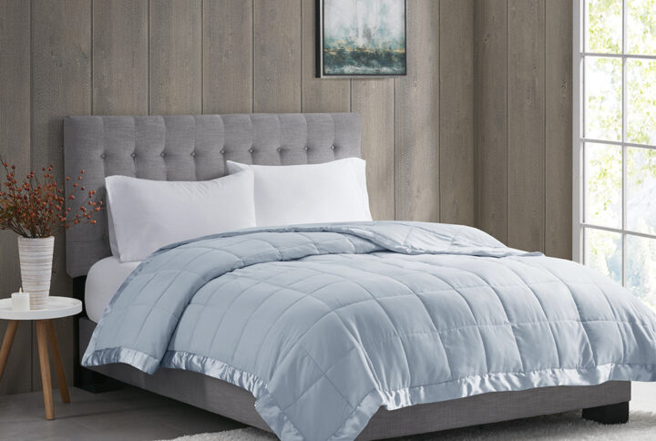 Windom Lightweight Down Alternative Blanket with Satin Trim in Blue From Madison Park