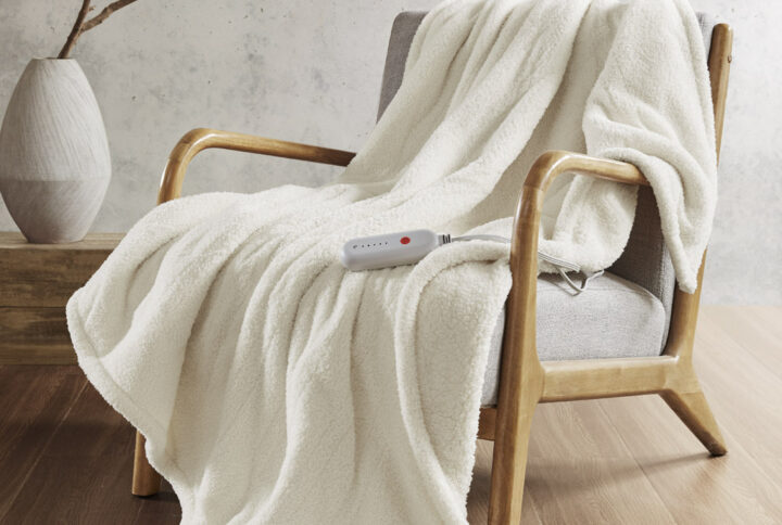 Amira Dream Soft Heated Throw in Ivory From Sharper Image