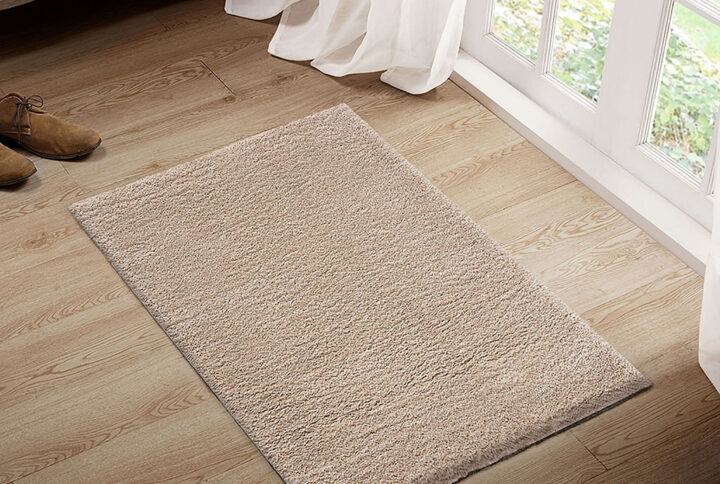 Camdyn Super Soft Polyester Shag Area Rug in Cream From Madison Park