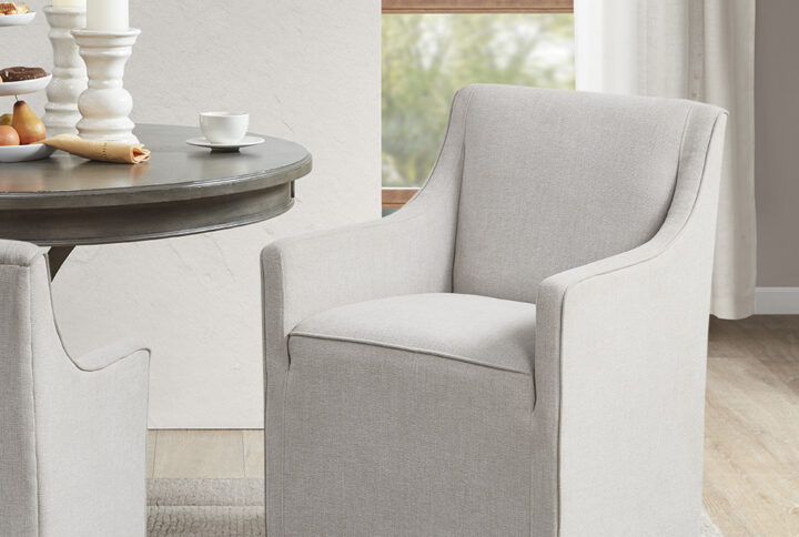 Charlotte Skirted Dining Arm Chair with Casters in Grey From Madison Park