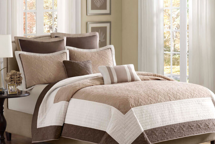 Attingham 7 Piece Quilt Set with Euro Shams and Throw Pillows in Beige From Madison Park