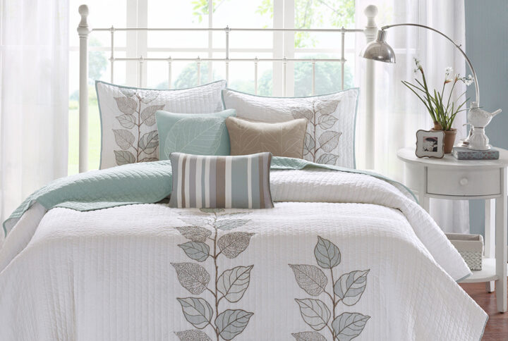 Caelie 6 Piece Embroidered Quilt Set with Throw Pillows in Blue From Madison Park