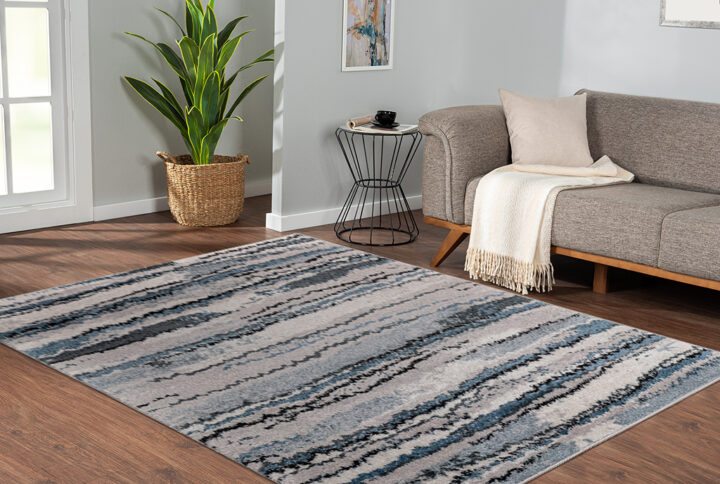 Riley Watercolor Abstract Stripe Woven Area Rug in Blue From Madison Park