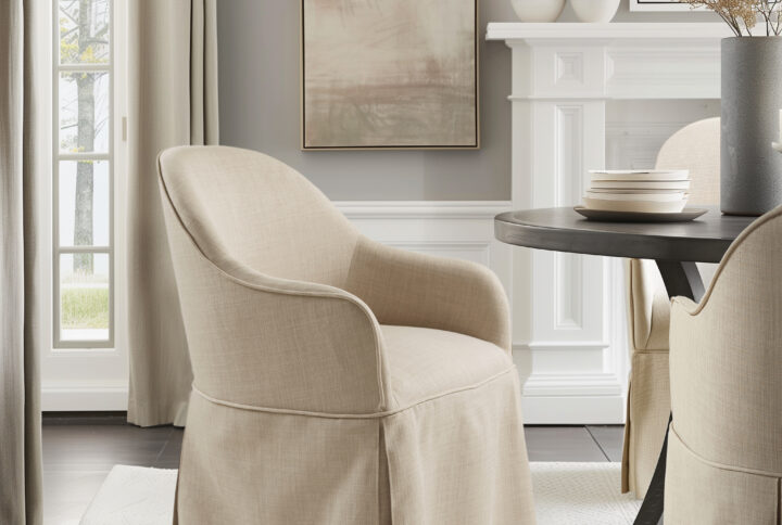 Salma Skirted Dining Arm Chair with Casters in Natural From Madison Park