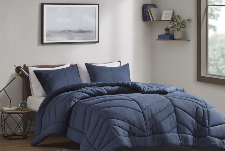 Remy Quilted Chevron Comforter Set in Navy From Intelligent Design