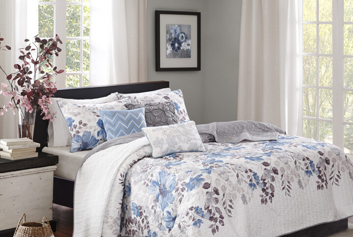 Luna 6 Piece Printed Quilt Set with Throw Pillows in Blue From Madison Park