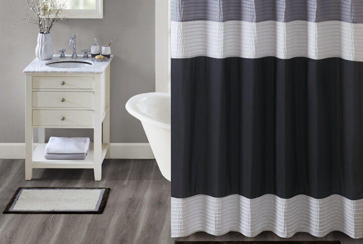 Amherst Cotton Tufted Bath Rug in Black From Madison Park